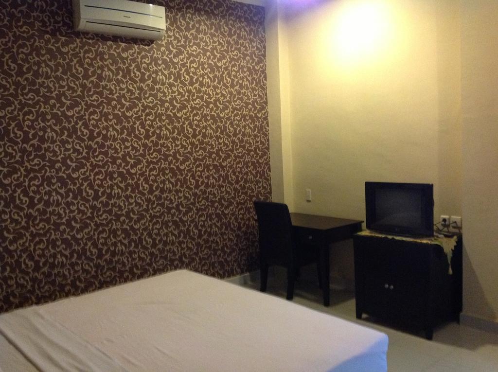 Carolina Transit Hotel Medan Phòng bức ảnh